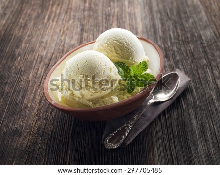 Vanilla Ice cream on a wooden background close up