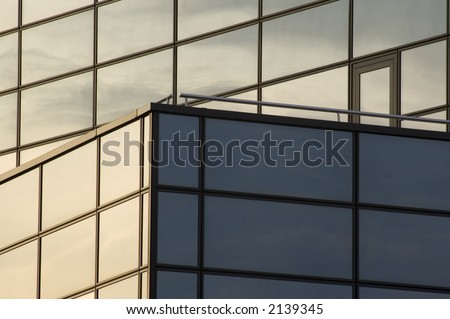 abstract reflecting windows on large business building