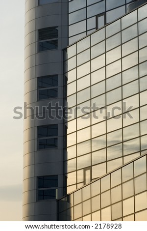 abstract reflecting windows on large business building