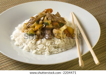 stock photo : beef china food gravy with rice on white plate