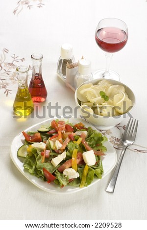 healthy plates of fresh potato salad and cheese salad