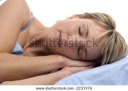 young woman in bed sleeping close up