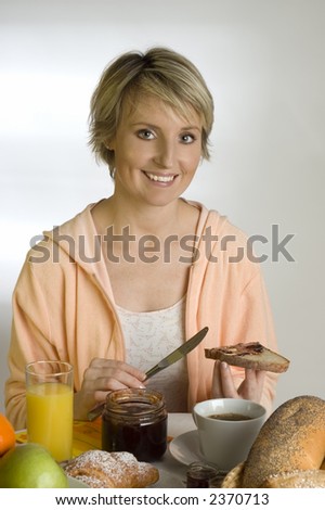 young woman at the table for breakfast