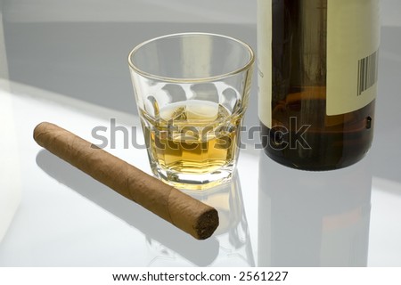 glass of whiskey and cigar close up shoot
