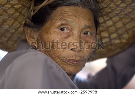 old thai woman portrait at thai market