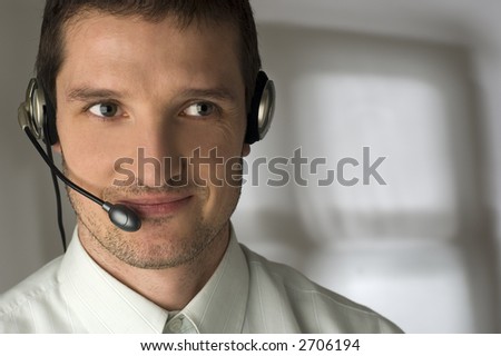 young smiling men operator with headphones portrait