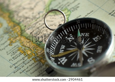 compass close up shoot on a retro map