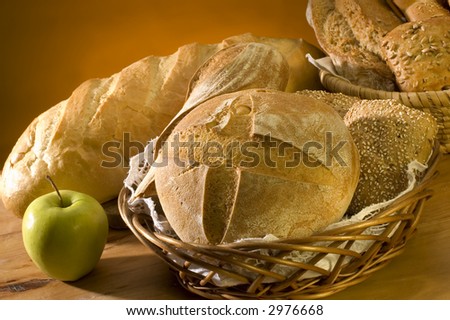 apple and different bread in basket close up