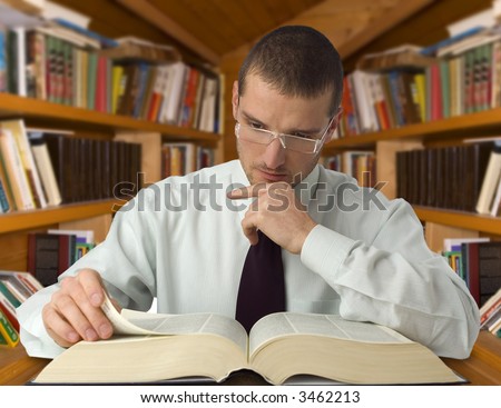 young business man reading a book portrait