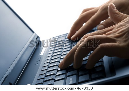 male hands typing on a laptop close up