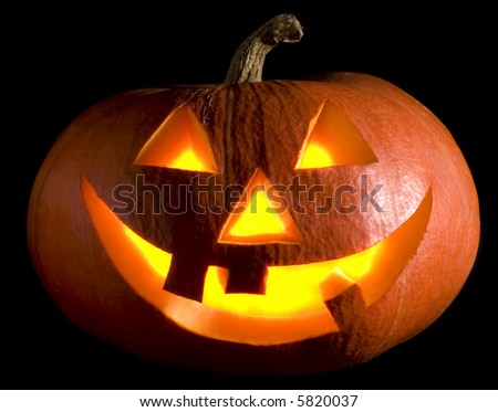 jack-o-lantern pumpkin on black background close up