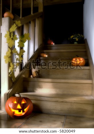 halloween pumpkins on stairs in the house at night