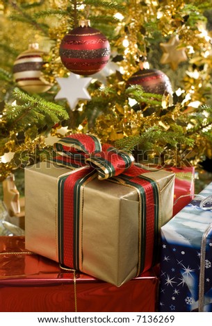 christmas gifts under christmas tree close up