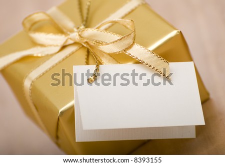 golden gift box with empty card close up shoot