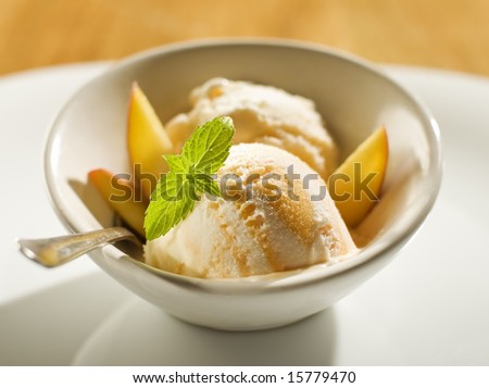 refreshing peach ice cream in a bowl close up