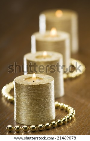 four golden advent candles close up shoot