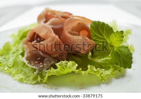 Prosciutto snack with sesame seeds close up
