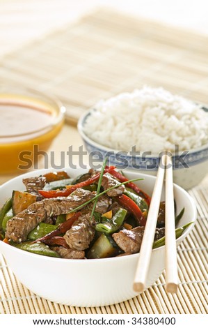 Beef and vegetables with rice close up