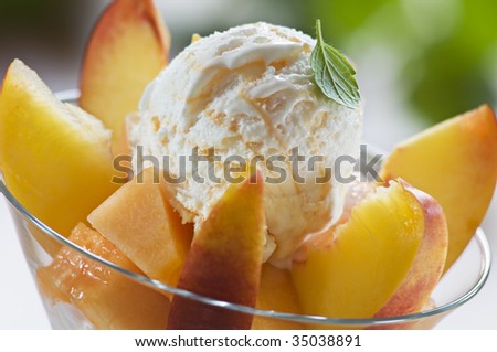 Refreshing peach ice cream in a glass close up