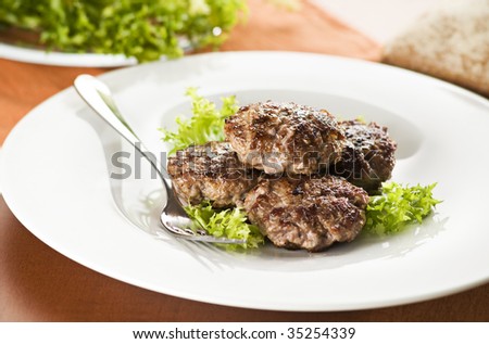 Fresh meat balls with salad close up shoot