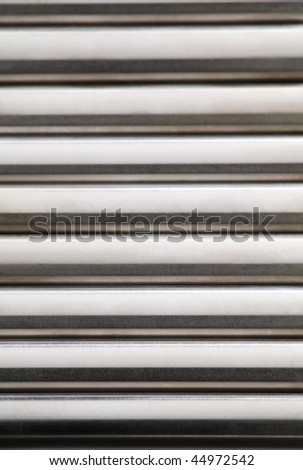 Metallic background made from metal rods close up