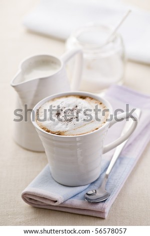 Fresh cappuccino with milk and sugar close up shoot