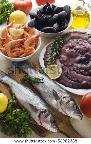 Fresh raw seafood with herbs close up shoot