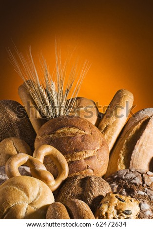 Mixed bread with orange background close up