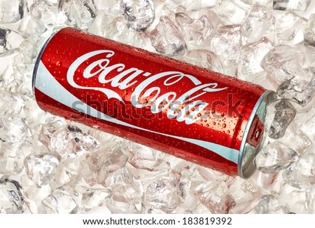 TURKEY - March 25, 2014: 250ml Classic Coca-Cola Can on crushed ice. Coca-Cola is one of the worlds favorite beverages.