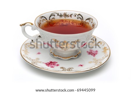 stock-photo-antique-tea-cup-full-of-tea-on-white-background-69445099.jpg
