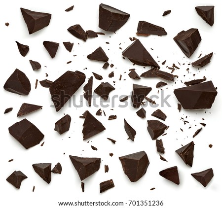 Cracked or broken chocolate chips / parts top view isolated on white background