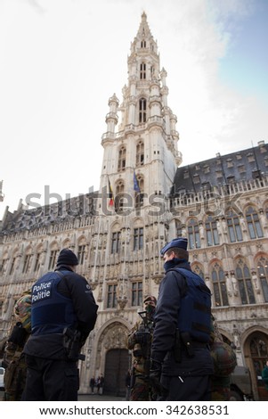 BRUSSELS - NOVEMBER 23: Belgium Army and police in Grand Place, the central square of Brussels due to security lock-down following terrorist threats. on November 23, 2015 in Brussels, Belgium.
