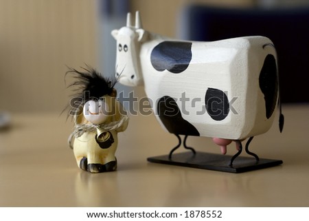 baby calf and cow in corporate environment