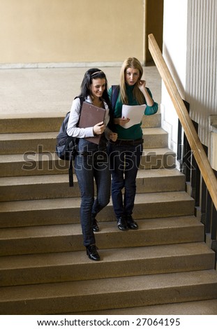 students climbing down stairs and chatting