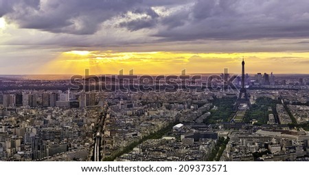 Eiffel tower ( Tour Eiffel ) in Paris at atmospheric dusk
