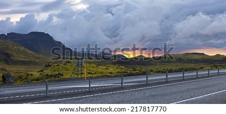 Road beside surreal landscape with wooly moss of Iceland