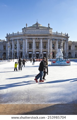 VIENNA, AUSTRIA - JANUARY 31, 2015:  Ice skating people at the Wiener Eistraum - is a mobile ice rink, which is built since 1996 every year between the City hall of Vienna and the Burgtheater.