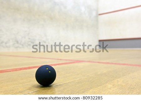 Squash ball in sport court