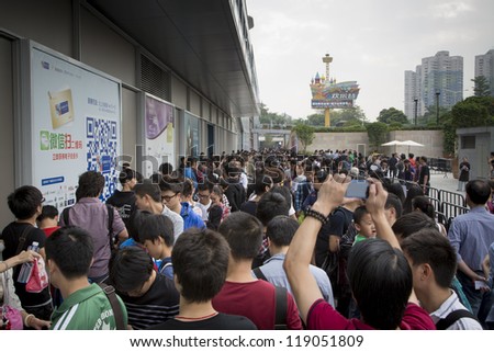 SHENZHEN, CHINA - NOV. 3: Fans gathering outside the new Apple store at Shenzhen, China. Apple open its seventh Apple store in mainland China, located in SHENZHEN on November 3, 2012.