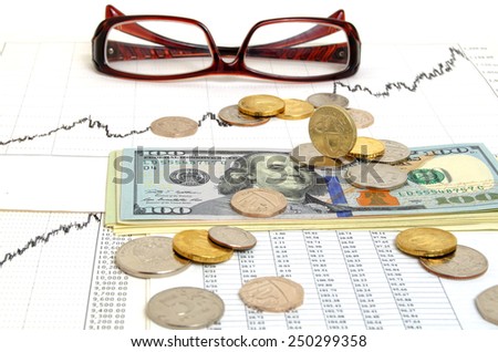 Still-life with the exchange graph coins and banknotes.