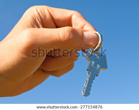 Key in hand - a symbol of the posession by premises.
