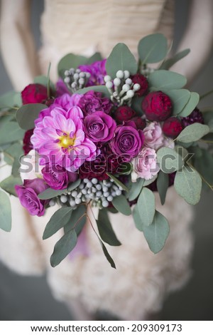 Bridal bouquet with red and burgundy colors
