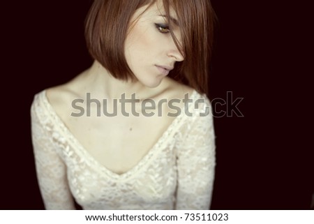 portrait of a beautiful girl in a white lace dress