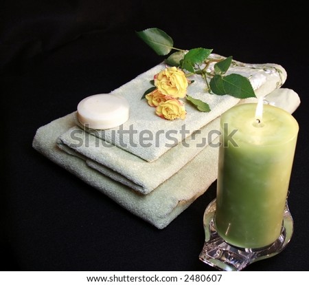 roses, candle, soap and towels for the bath