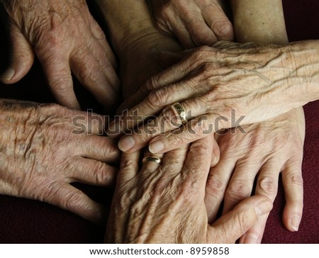 abstract grouping of elderly hands
