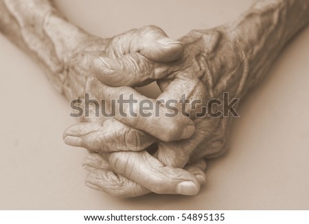 pair of elderly wrinkled hands in prayer