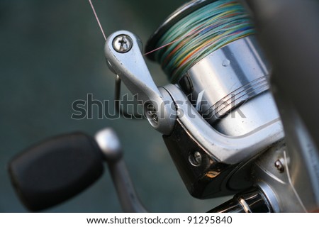 Fishing reel with co-filament line on it. Setup for fish casting (angling)