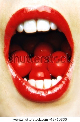A womans mouth wide open with jaffers inside it
