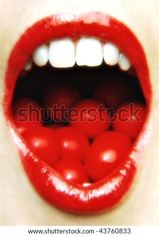 A womans mouth wide open with jaffers inside it