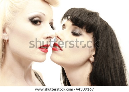 a stunning woman being seduced by another woman.